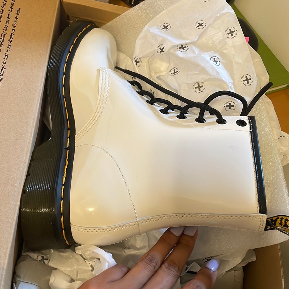 Brand new, never been worn. Patent white leather.
